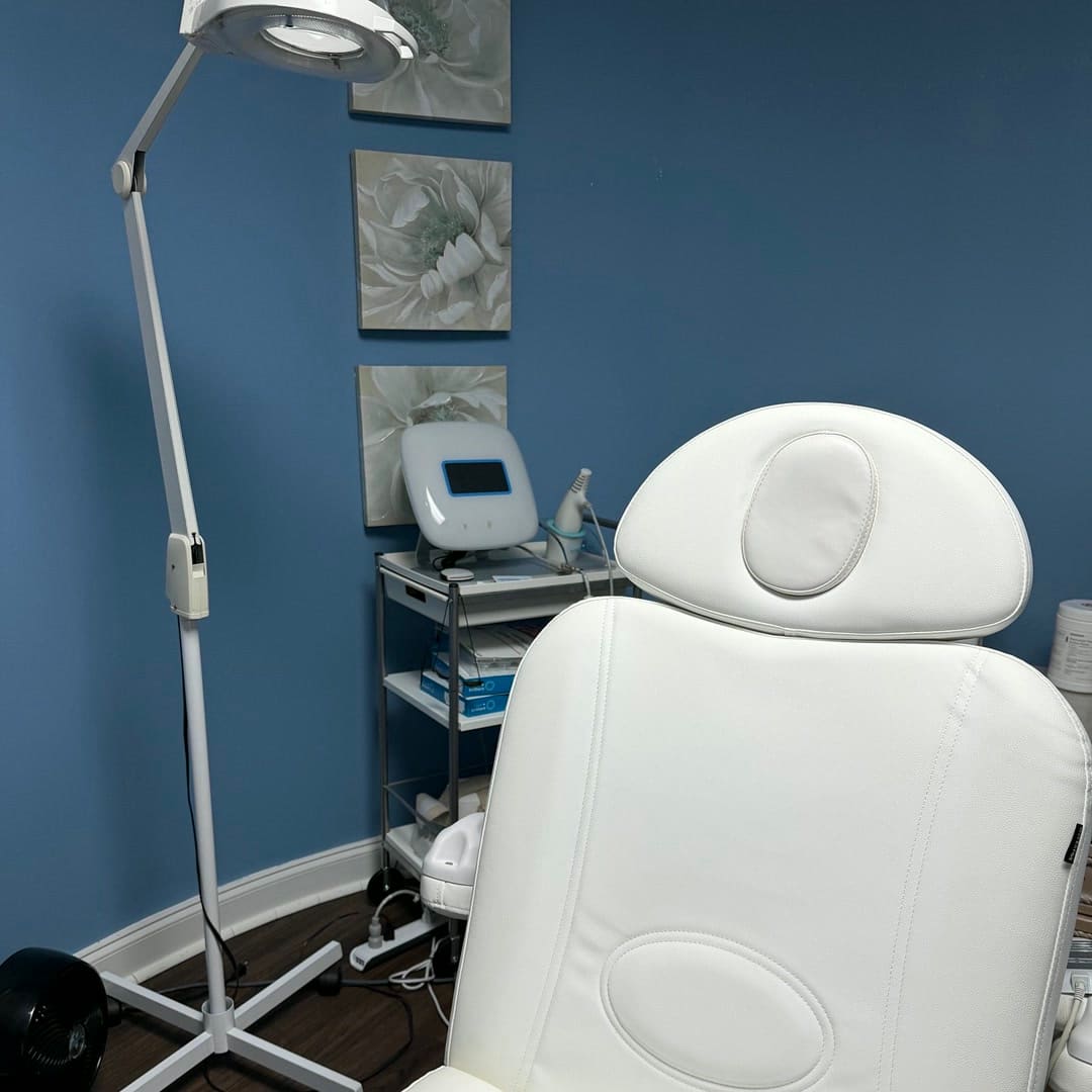 White treatment chair and magnifying lamp inside Beauty Medica